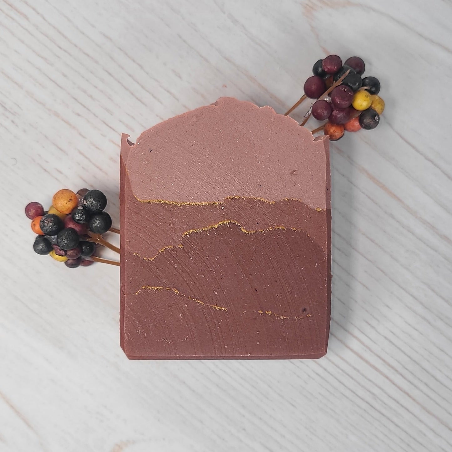Spiced Cranberry handmade soap bar on a light gray background